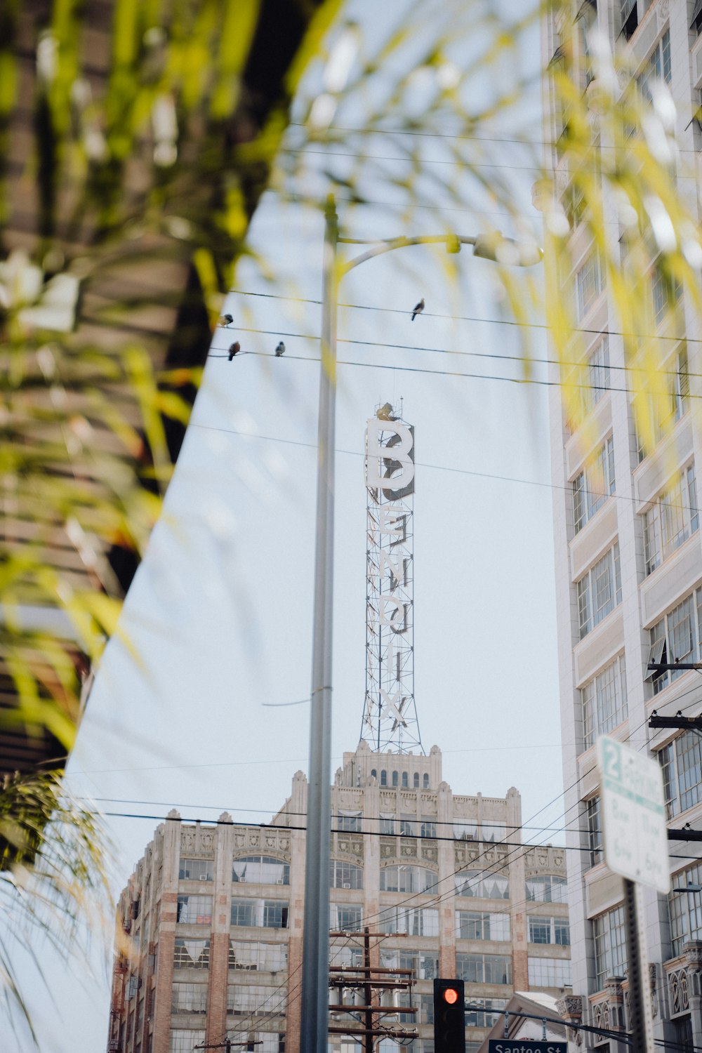 a traffic light sitting next to a tall building