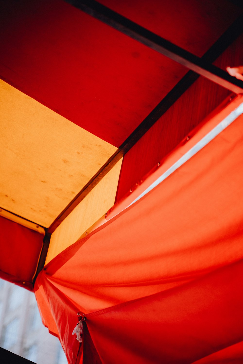 a close up of a red and yellow umbrella