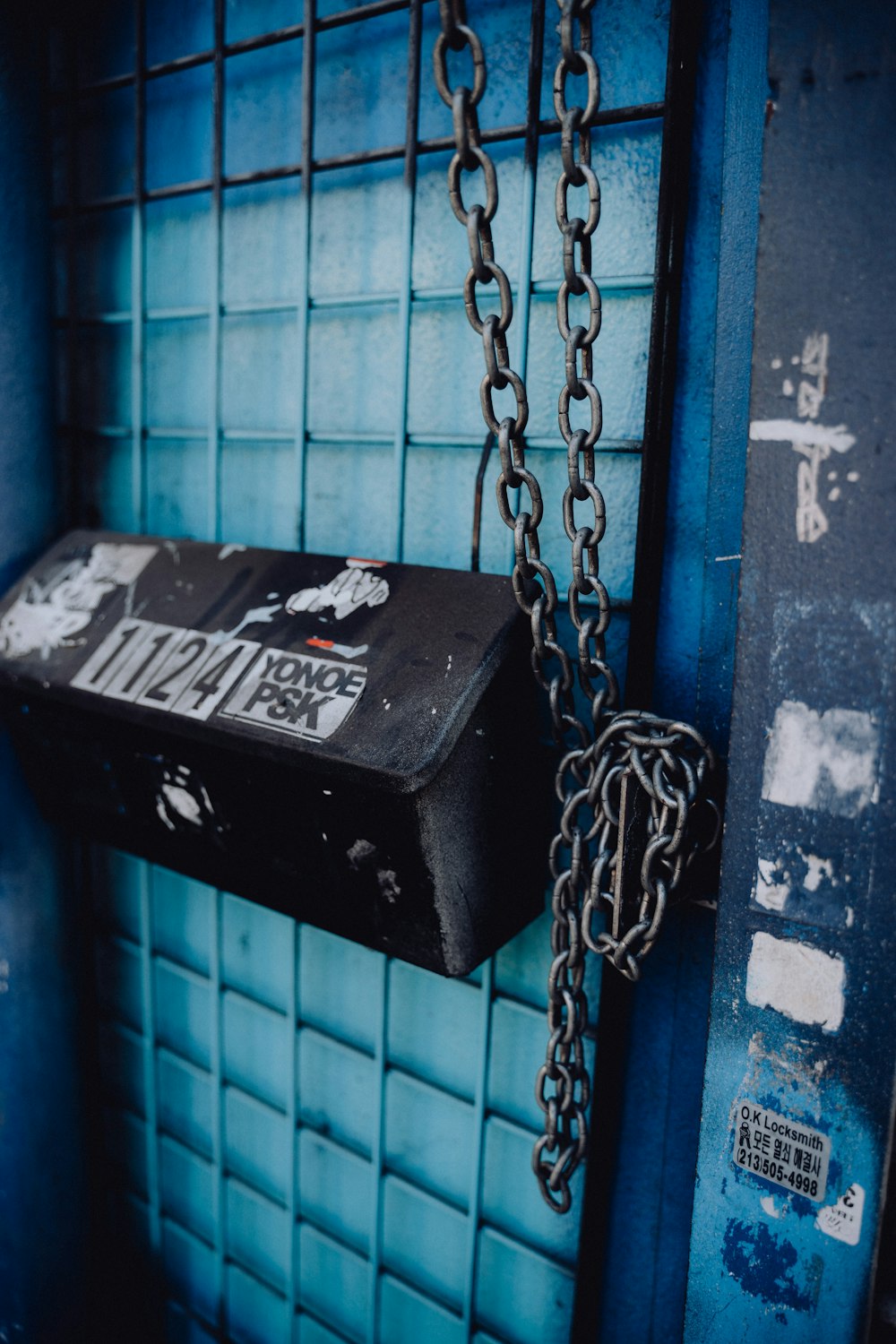 a black box with a chain hanging from it