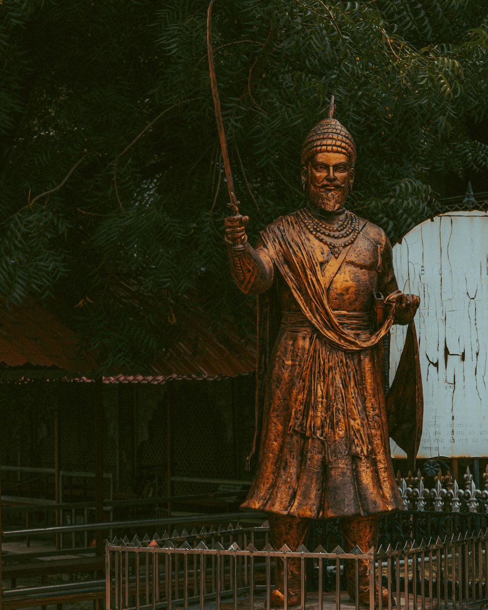 a statue of a man holding a fishing rod