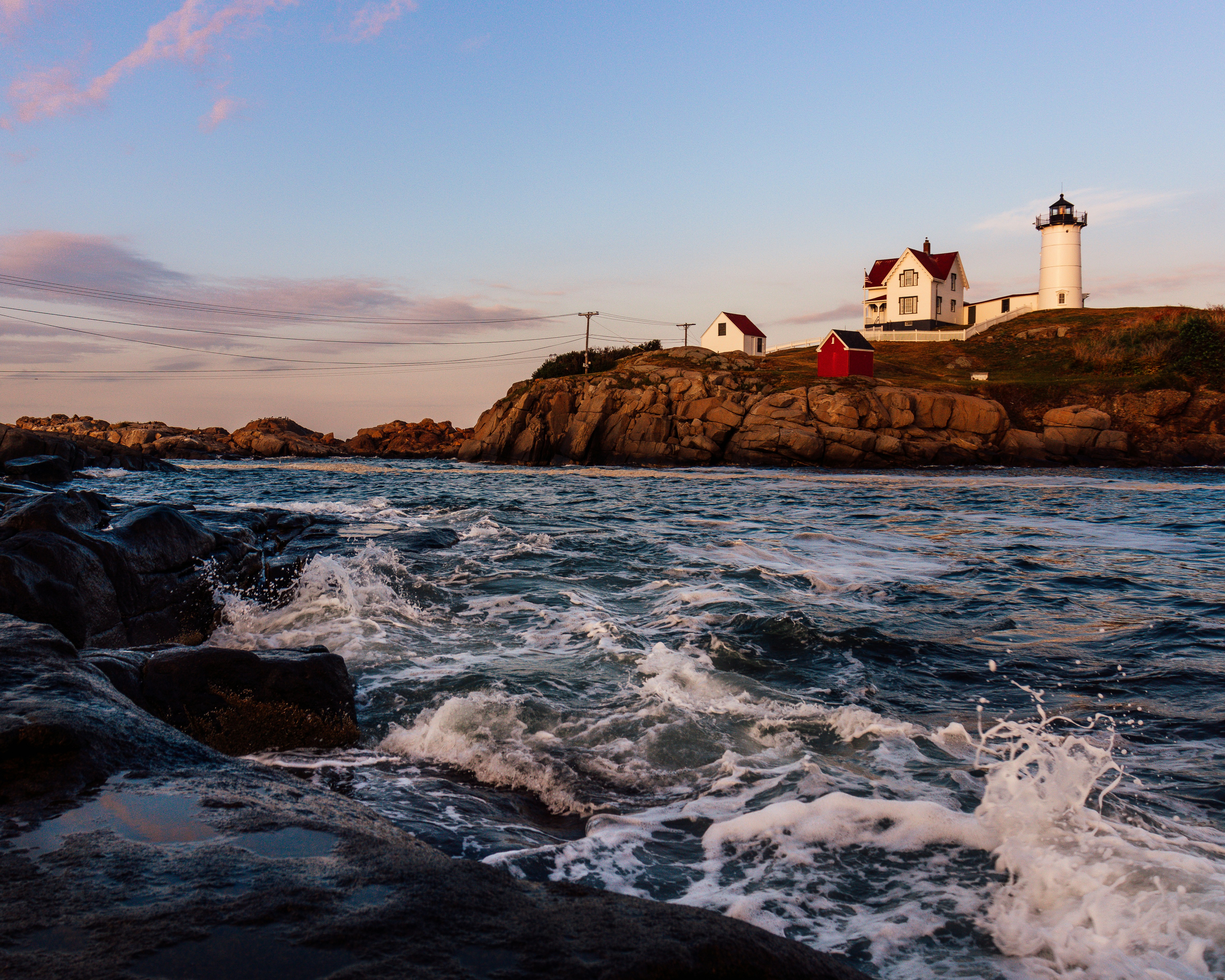 Nubble Lighthouse on a summer evening at sunset.