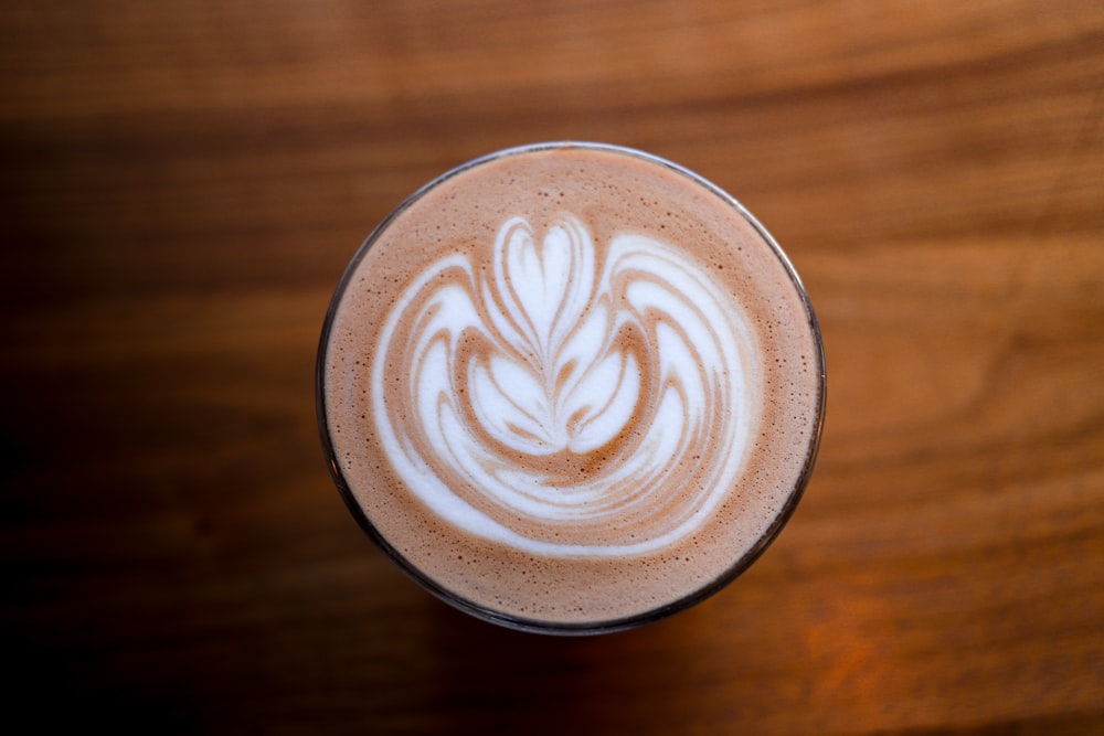 a close up of a cup of coffee on a table