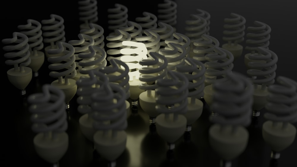 a group of light bulbs with a black background