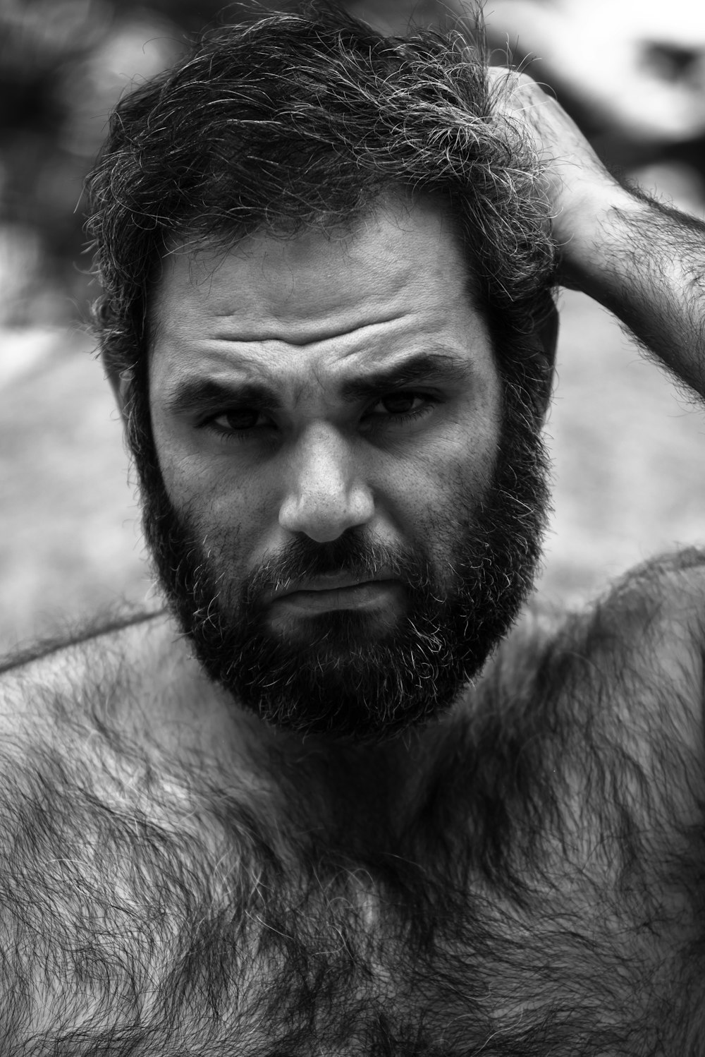 a man with a beard and no shirt on