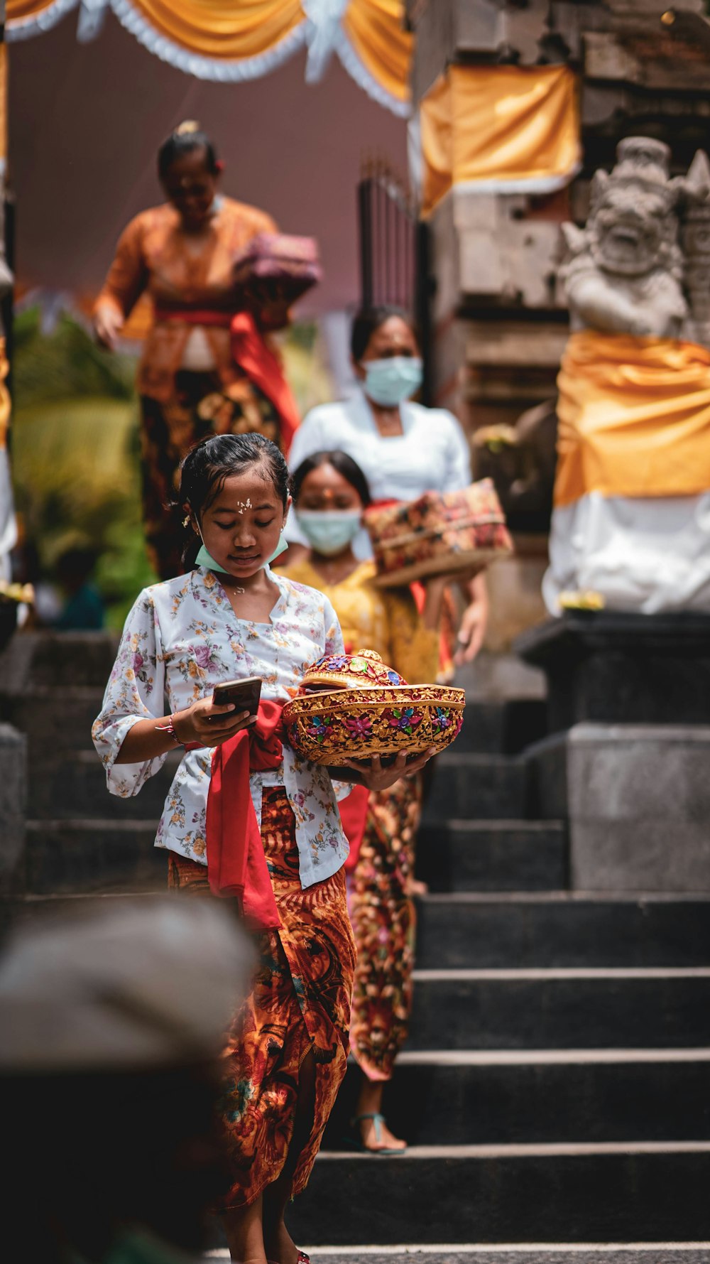 a woman walking down a set of stairs