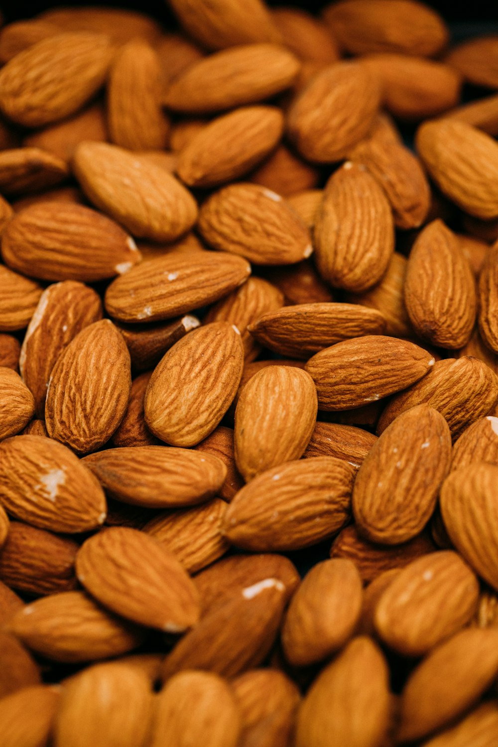 a pile of almonds sitting on top of each other