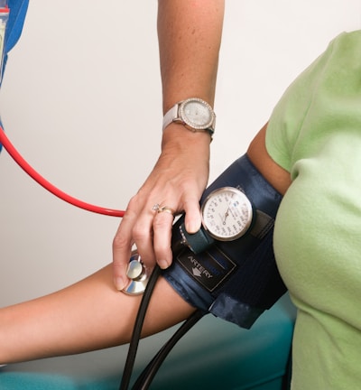 a person with a blood pressure meter on their arm