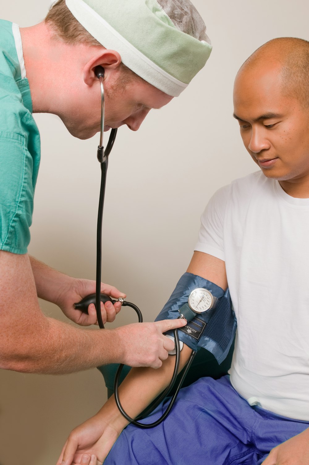 a man with a cast on his head is being examined by a doctor