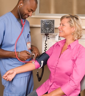 a doctor checking a patient's blood with a stethoscope