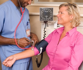 a doctor checking a patient's blood with a stethoscope