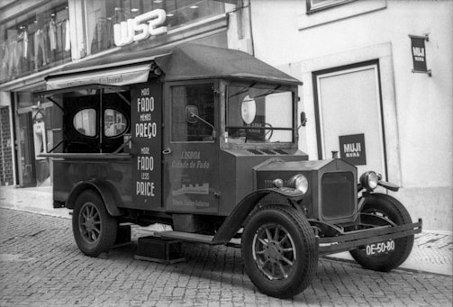 a black and white photo of an old truck