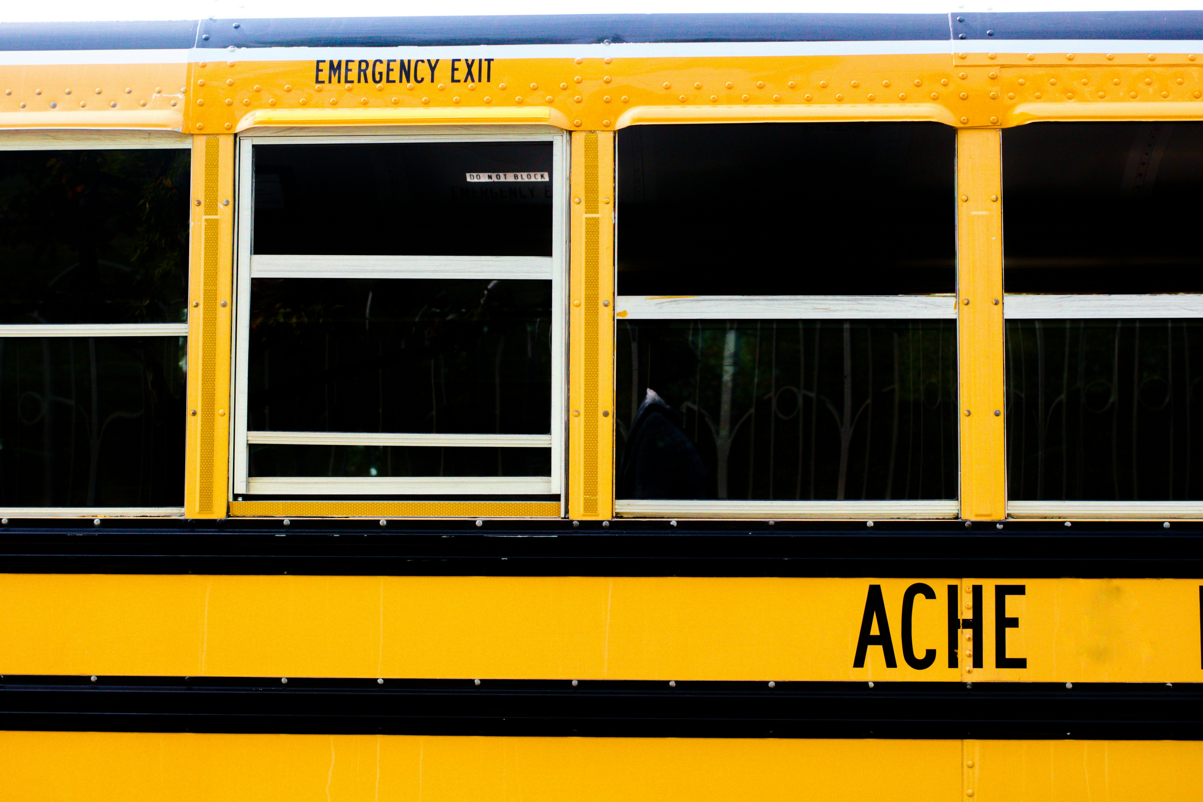 a yellow school bus with the words ache on it