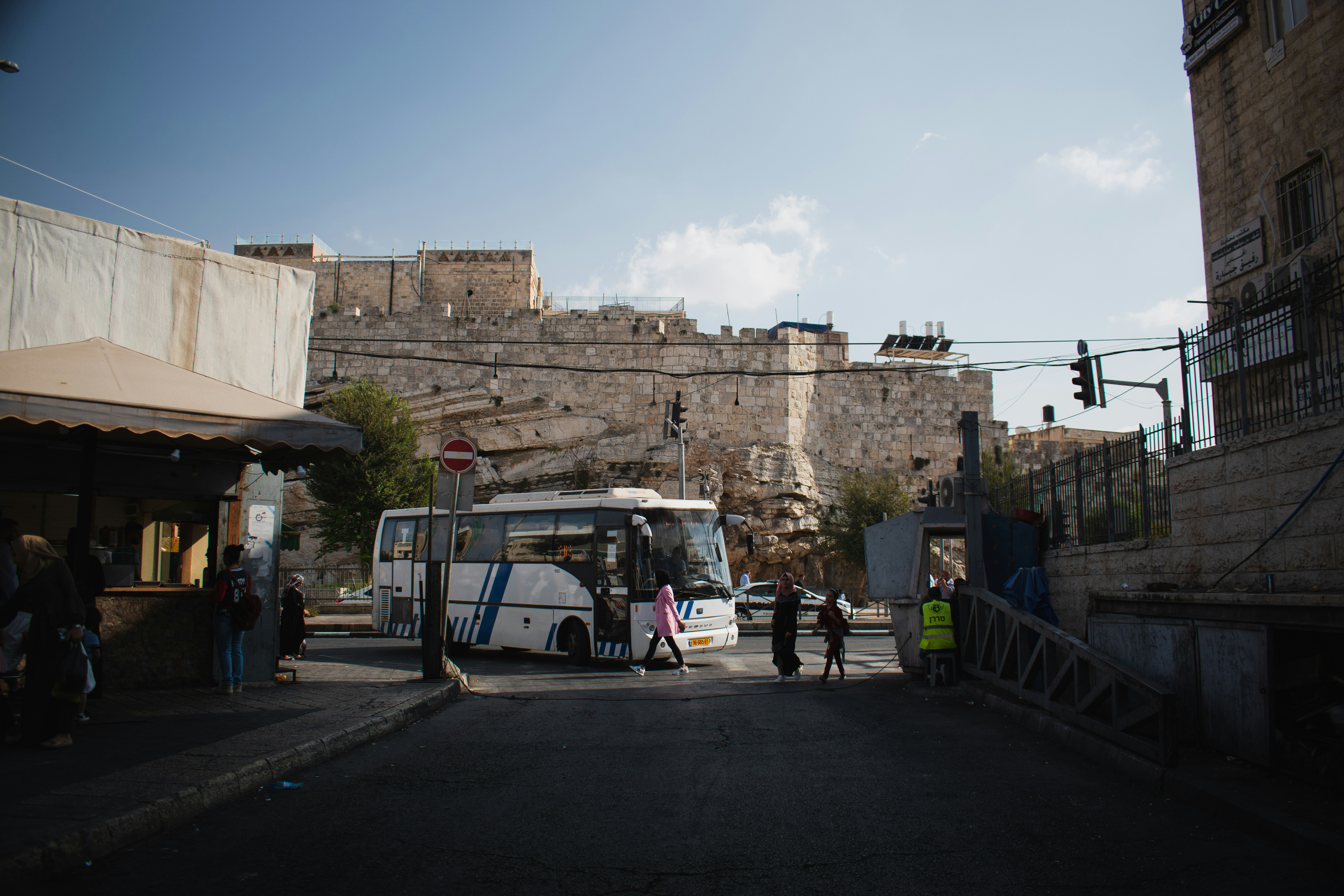 a bus is parked on the side of the road