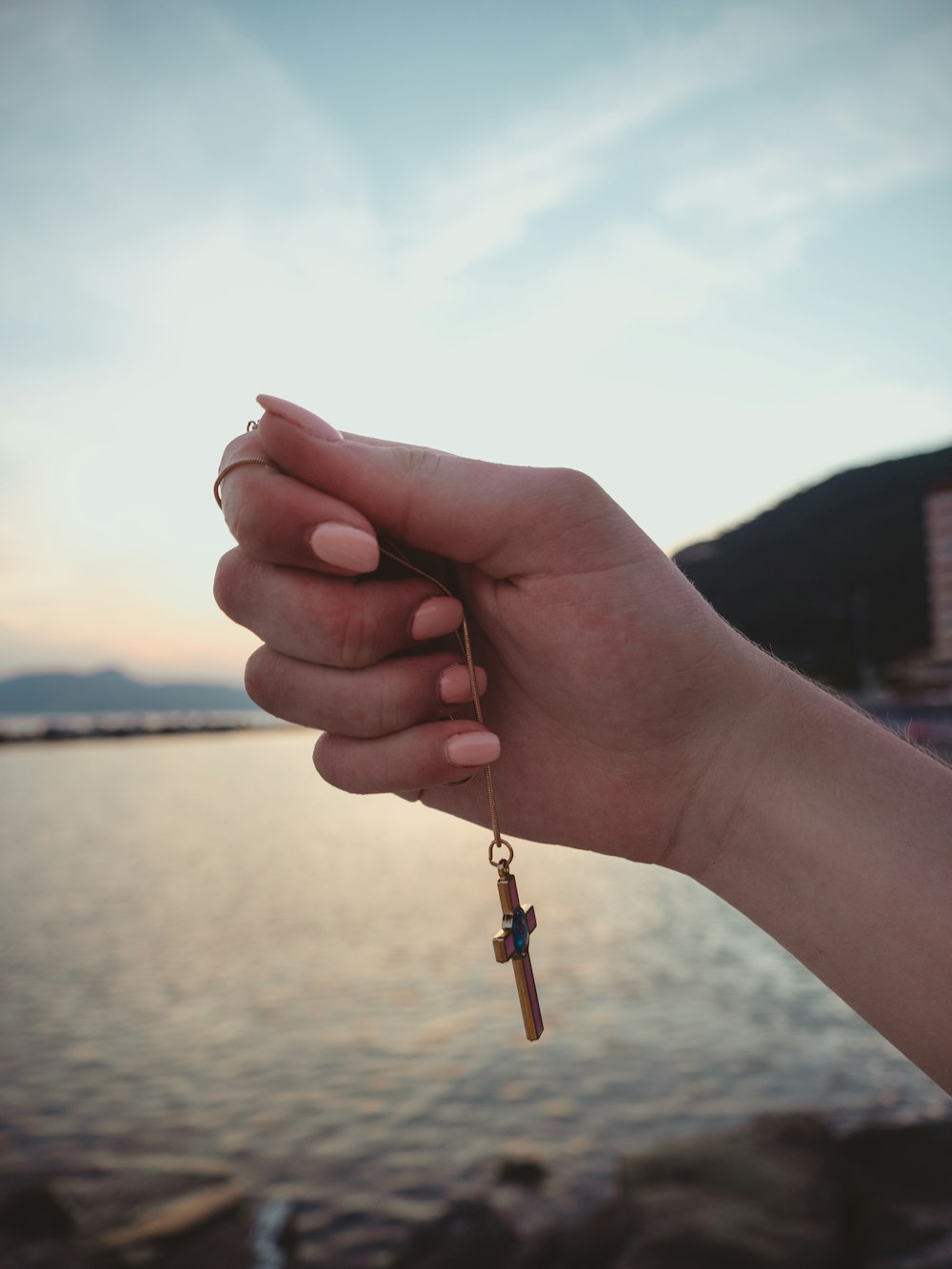 a person holding a key to a body of water