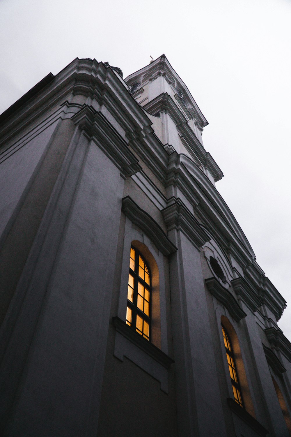 a tall building with a clock on the top of it