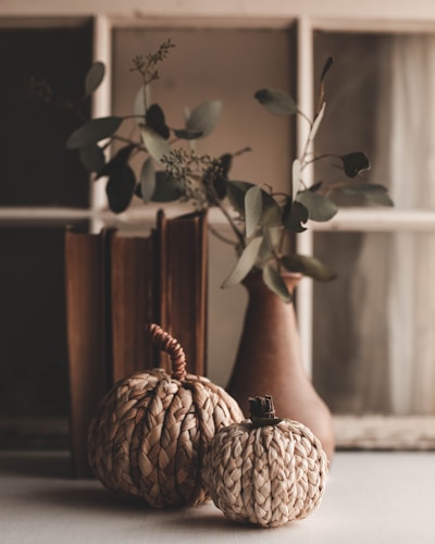 a couple of vases sitting on top of a table