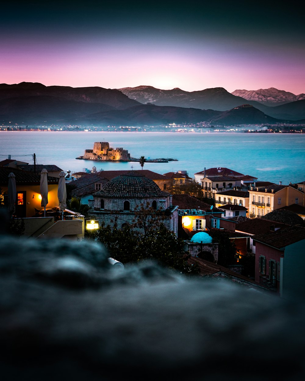 a view of a city with mountains in the background