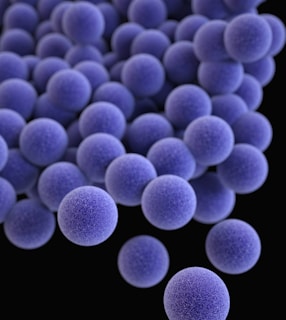 a bunch of blue balls on a black background