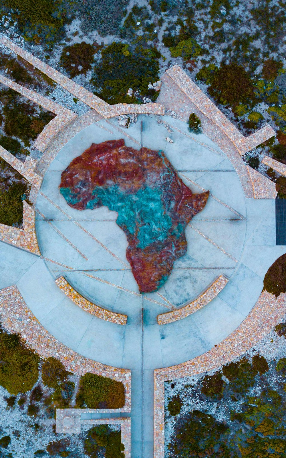 an aerial view of a fountain in a park