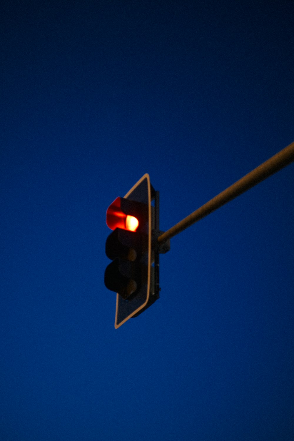 a traffic light with a blue sky in the background