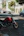 a red motorcycle parked on the side of the road