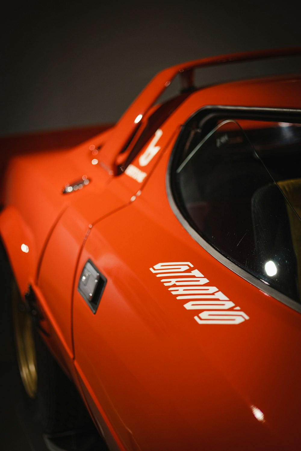 a close up of a red sports car