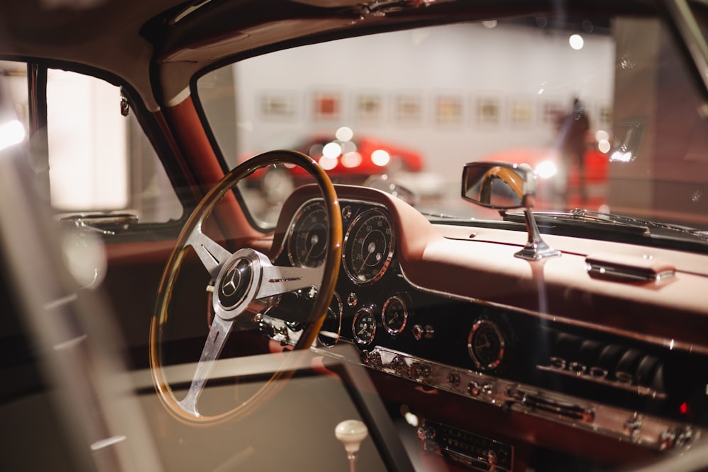 the interior of a car with a steering wheel and dashboard