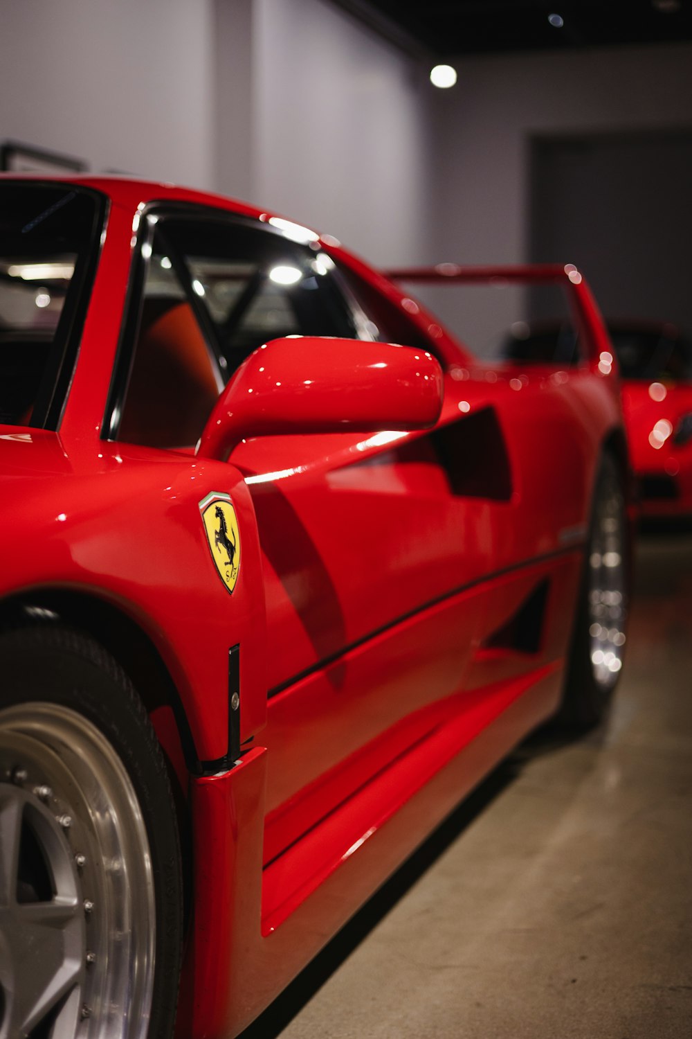 a red sports car parked in a garage