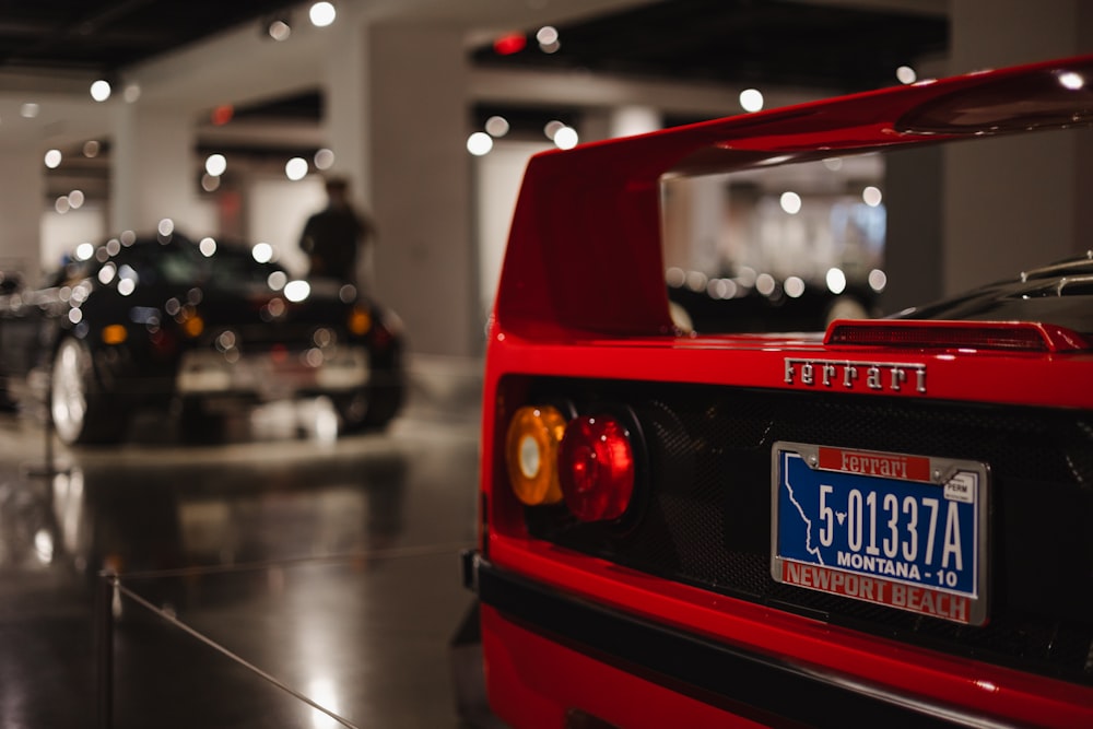 a red sports car parked in a parking garage