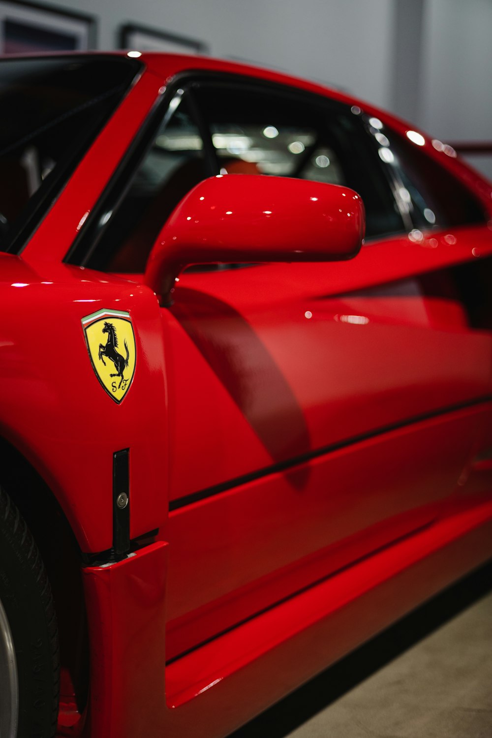 a red sports car parked in a garage