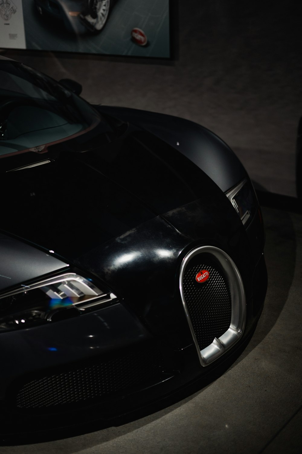 a black sports car parked in a garage