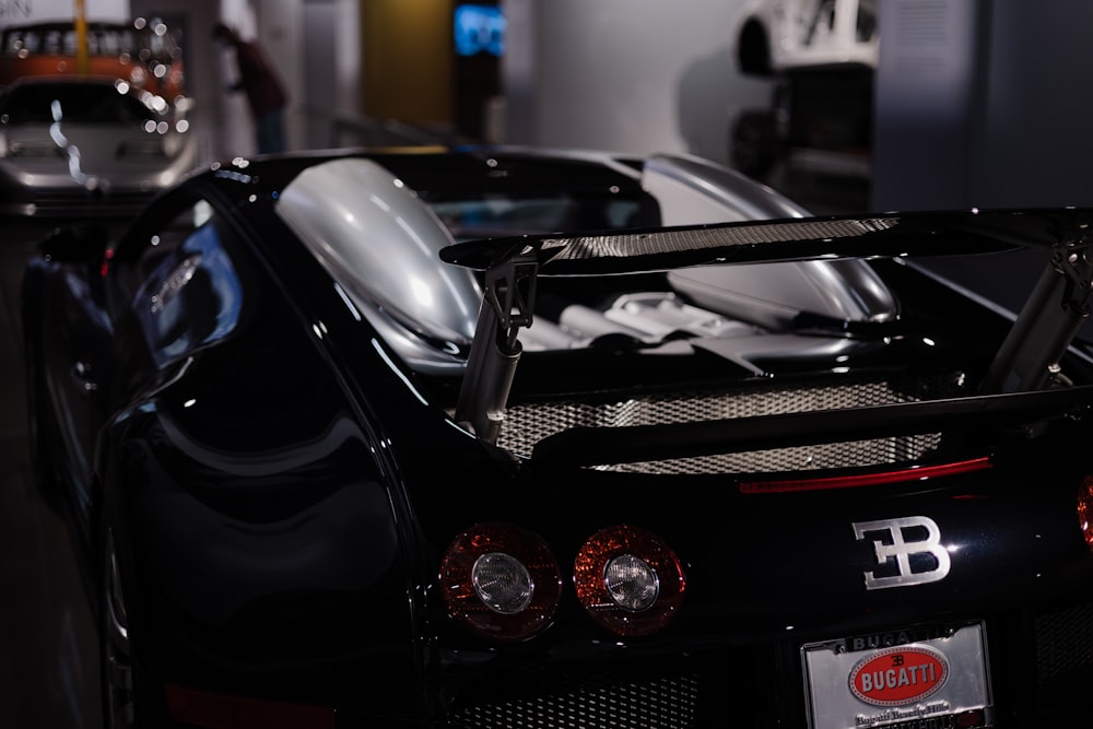 a black sports car parked in a garage