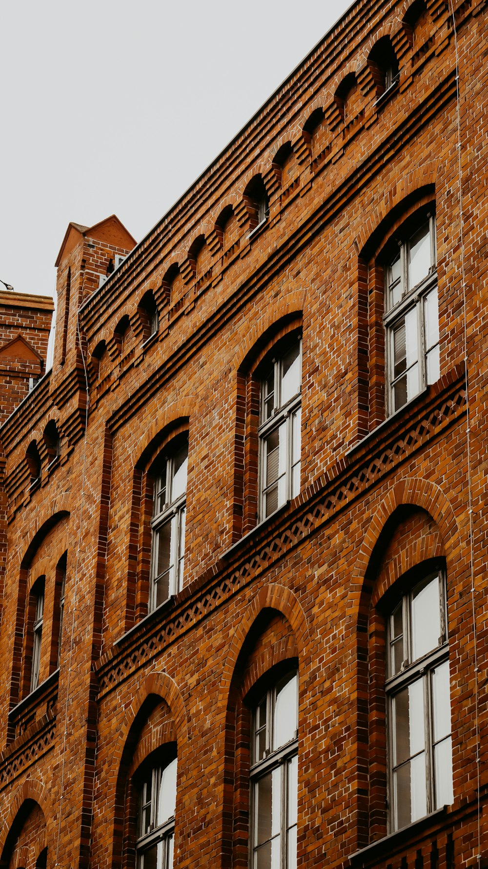 a tall brick building with many windows