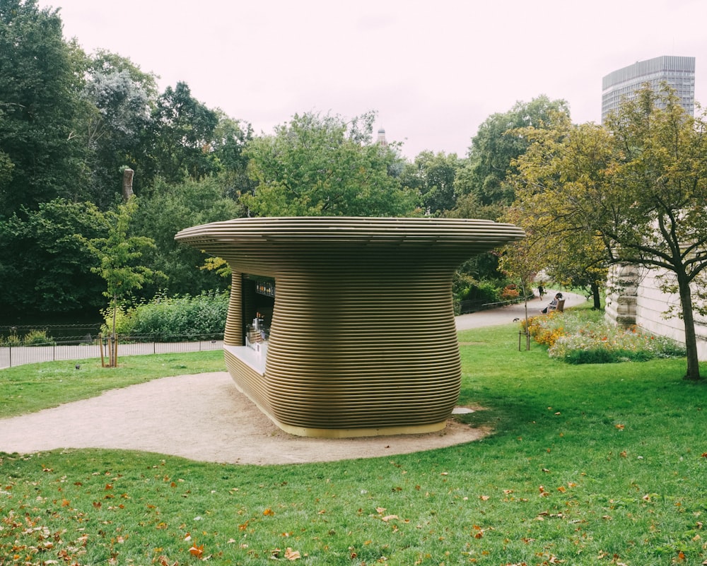 a sculpture in the middle of a park