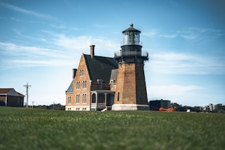 a large brick building with a light house on top of it