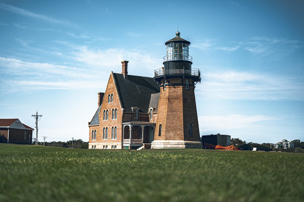 a large brick building with a light house on top of it