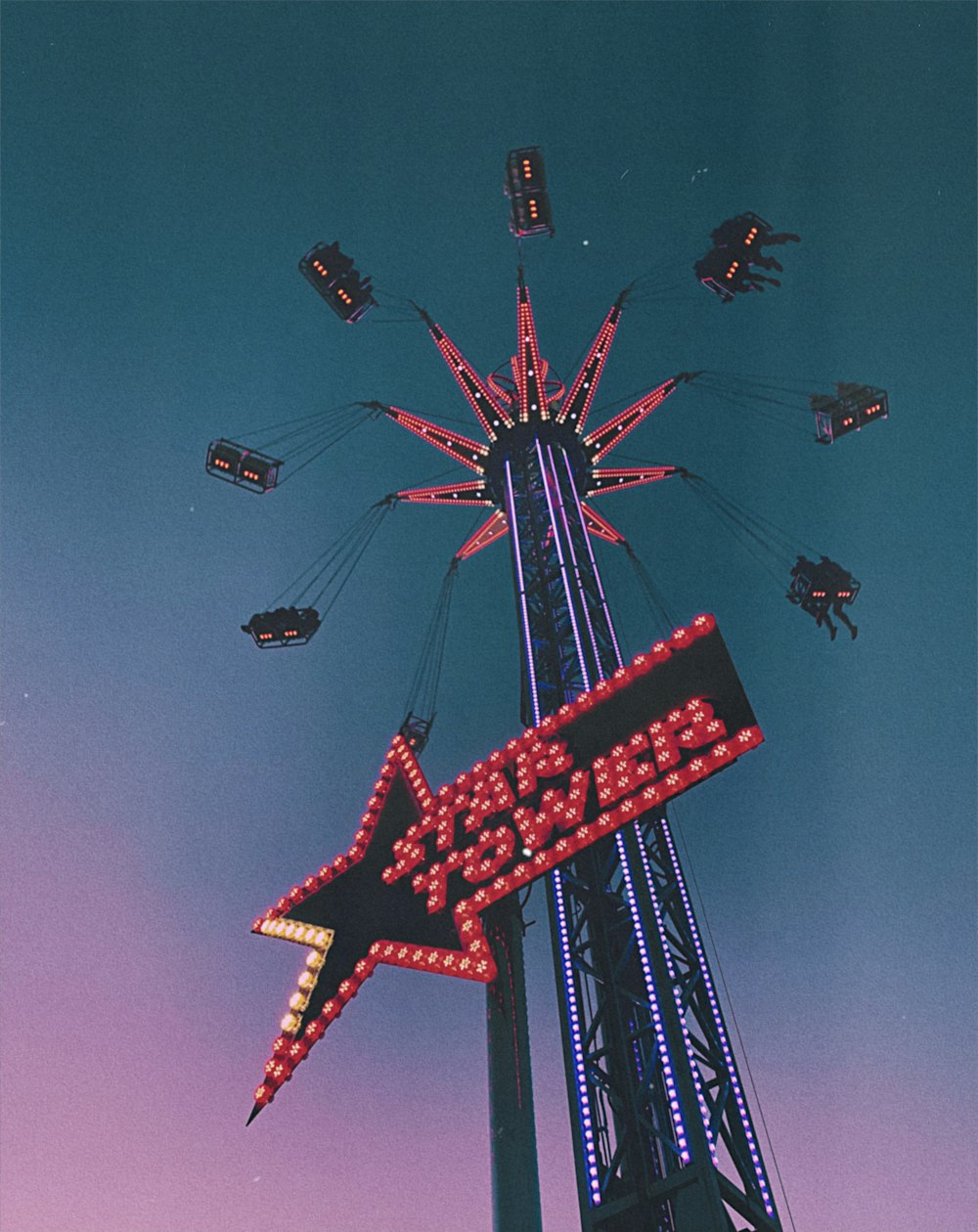 a ferris wheel with a star sign on it