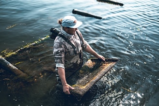 a man standing in a body of water