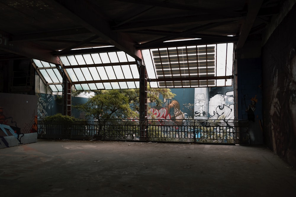 an empty room with graffiti on the walls