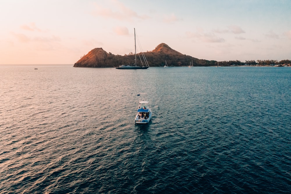 a small boat in the middle of a large body of water