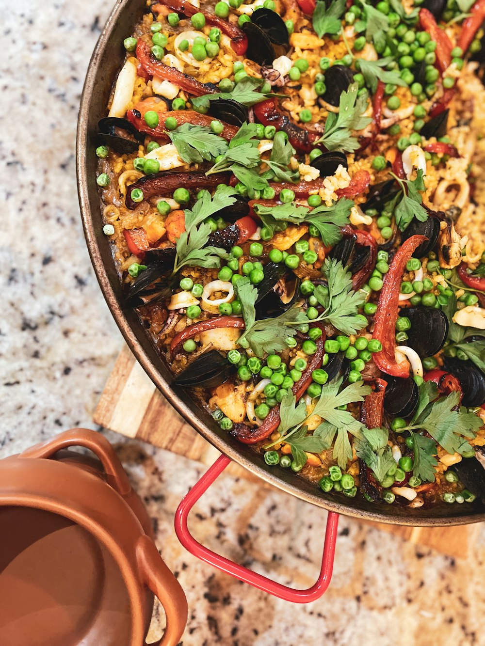 a pan filled with peas and other vegetables