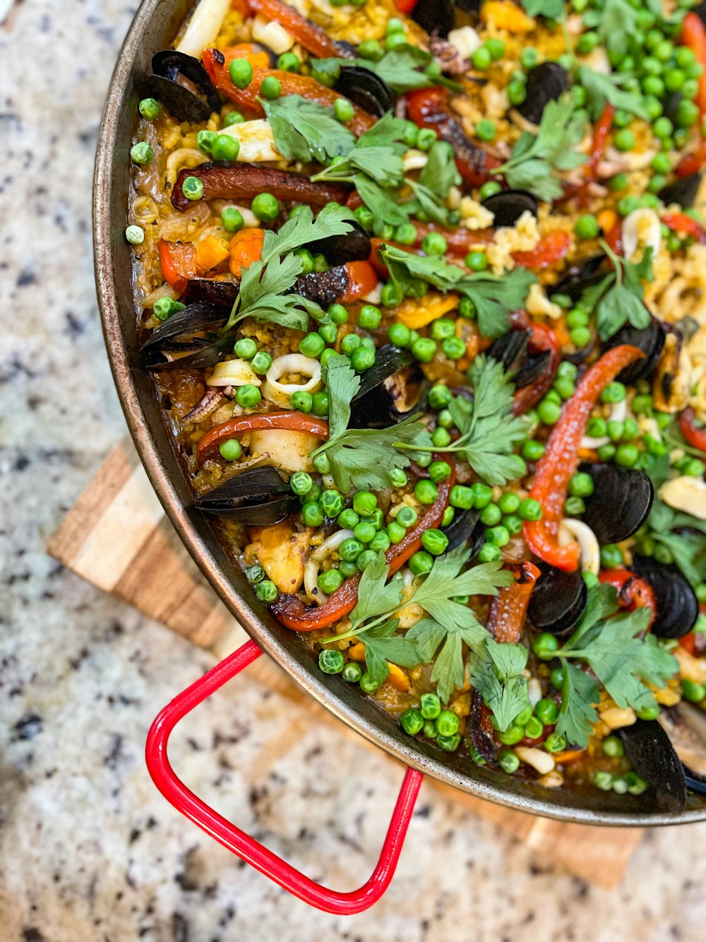 a pan filled with peas, carrots, and other vegetables