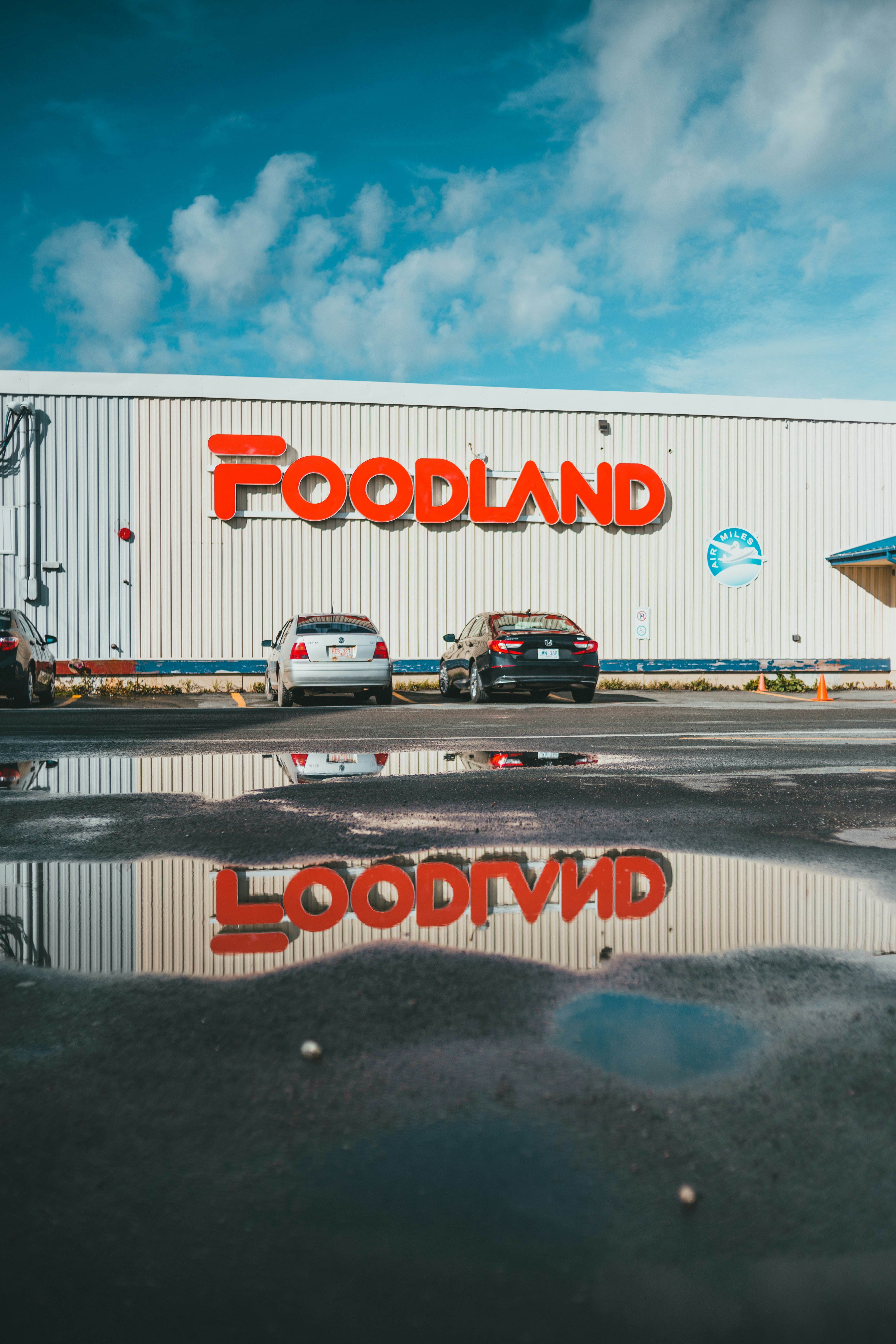 a building with cars parked in front of it