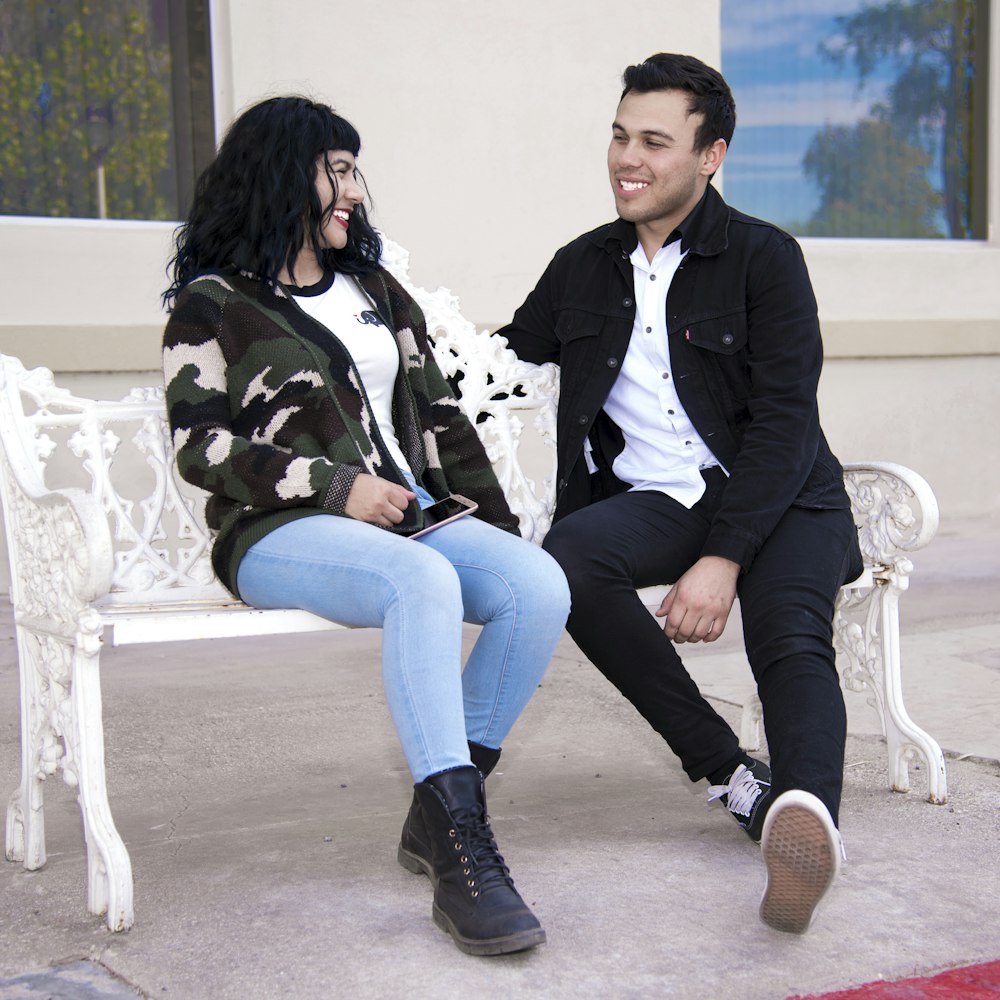 a man and a woman sitting on a bench