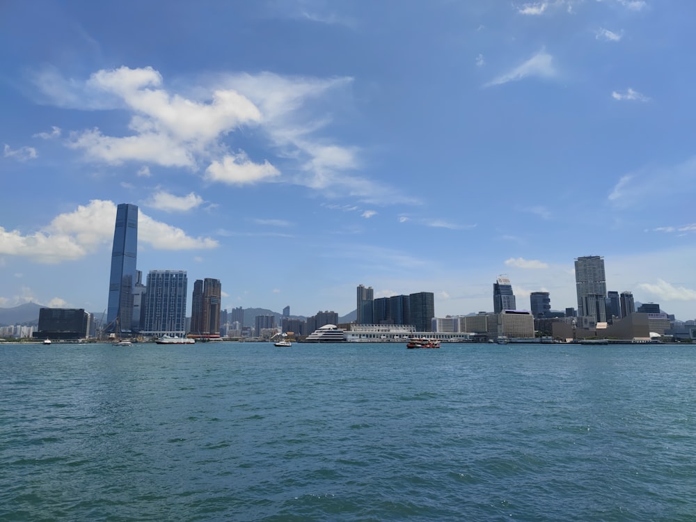 a body of water with a city in the background