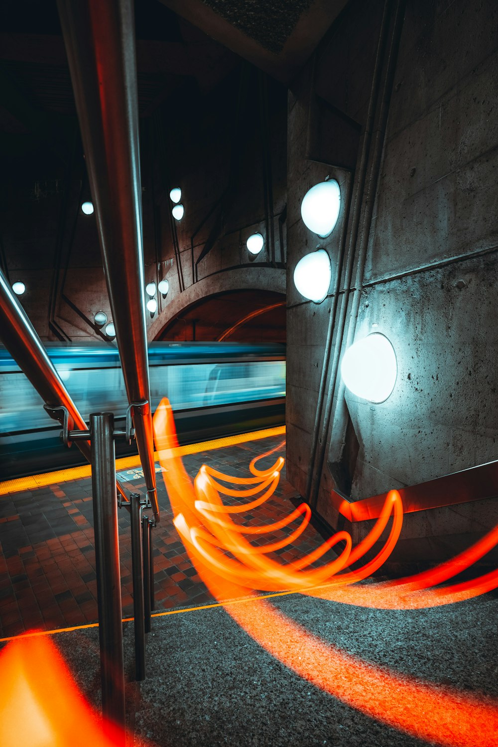 a train traveling through a tunnel with bright lights