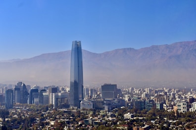 a view of a city with mountains in the background