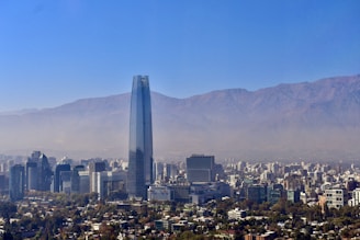 a view of a city with mountains in the background