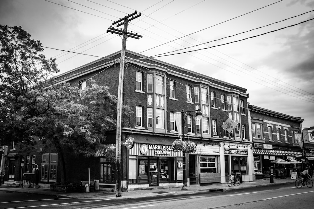 a black and white photo of a street corner