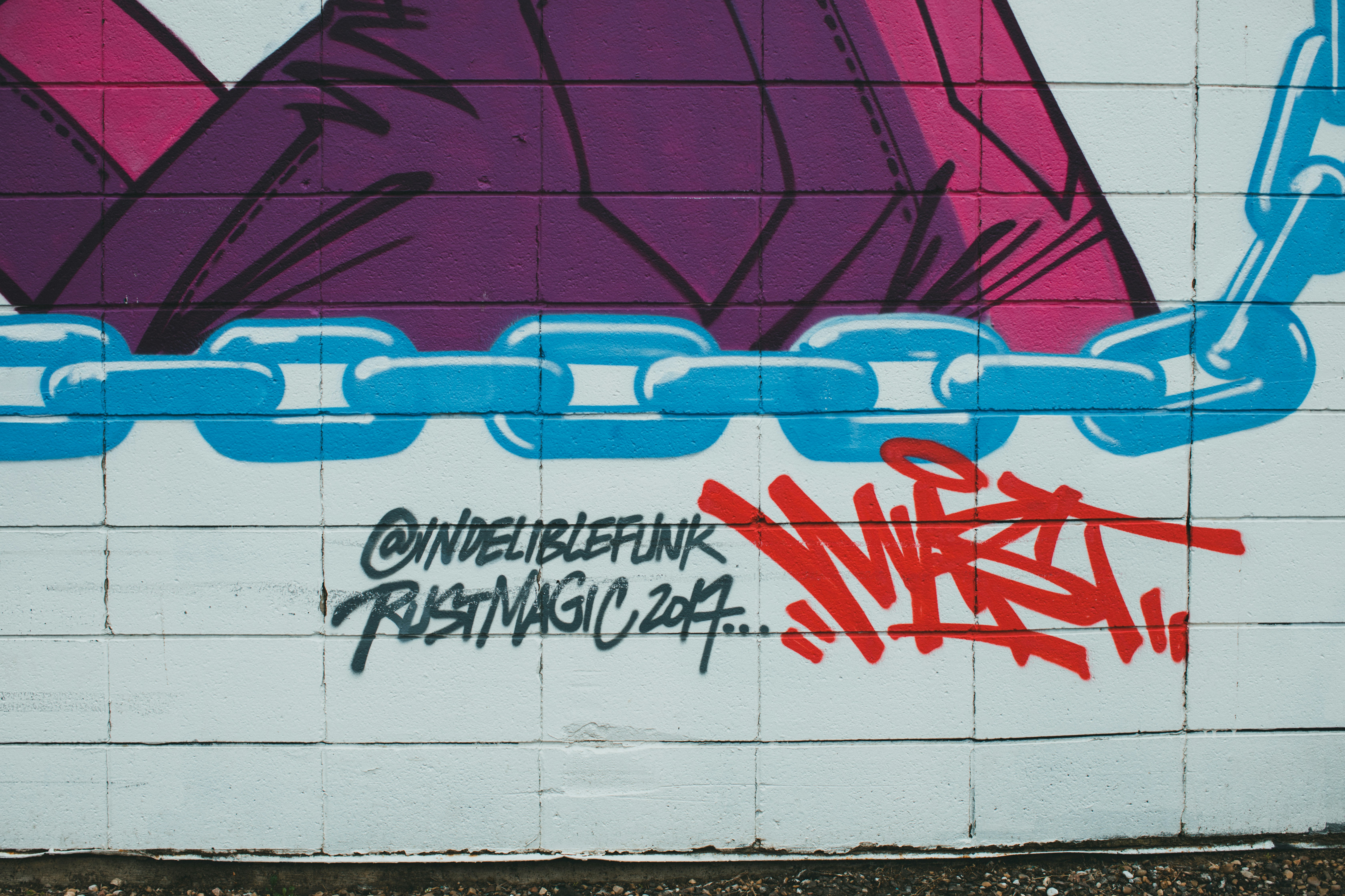 a wall that has some graffiti on it